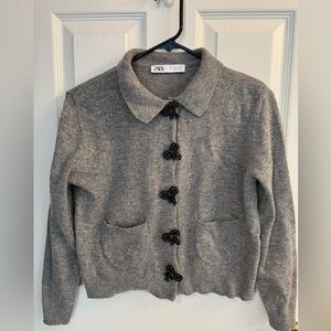 Zara women’s medium bow snap sweater